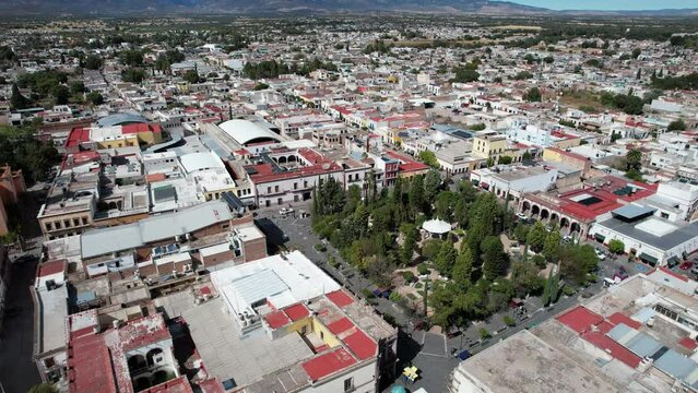 Drone performs a semi-orbit capturing the view of Rafael Paez garden in Jerez, Zacatecas.