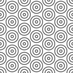 Repeated small and big black circles background. Seamless surface pattern design with circular ornament. Hoops wallpaper. Round motif. Spheres image. Digital paper with rings. Vintage style vector art