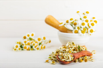 Dried chamomile tea on texture table.dry chamomile. Chamomile tea. flat lay. Composition with a...