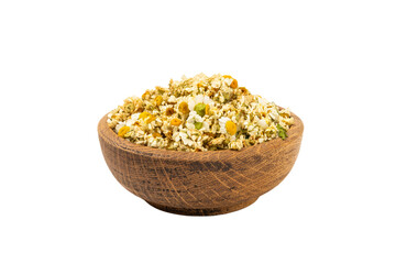 Dried chamomile tea in wooden bowl isolated on white background.dry chamomile. Chamomile tea.