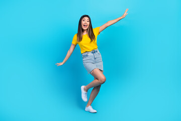 Fototapeta na wymiar Full body photo of carefree positive lady have good mood dancing chilling isolated on blue color background