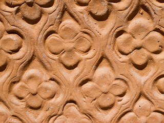 Detail of a garden flower pot in terracotta with a beautiful pattern.