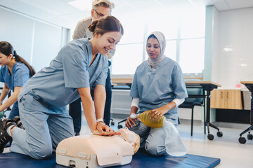 Female students receiving CPR training during healthcare simulation in medical school