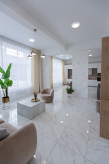 light luxury interior design of a modern apartment in a minimalist style with marble trim and huge windows. daylight inside the kitchen and living room