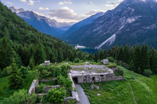 Alpine landscape with green forest in Predil Pass, Italy. Aerial drone view