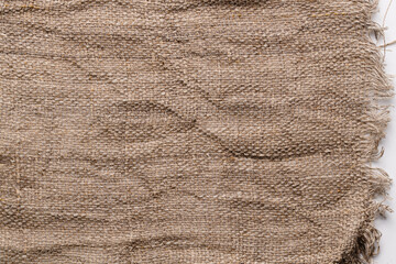 Piece of undyed linen isolated on white background with copy space. fabric sample mockup