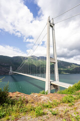 Hardanger Bridge is the longest suspension bridge in Norway. Hardangerbrua connecting two sides of Hardangerfjorden. Hardangerbrua bridge close to Ulvik in Western Norway