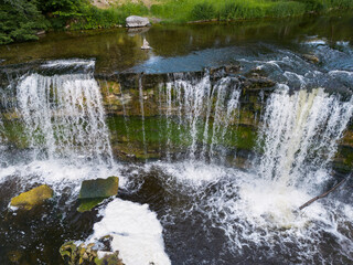 Obraz premium Keila-Joa waterfall on a summer day, close-up view from a height.