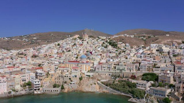 Aerial: Slow panning drone shot of Ermoupoli in Syros island, Greece on a sunny day