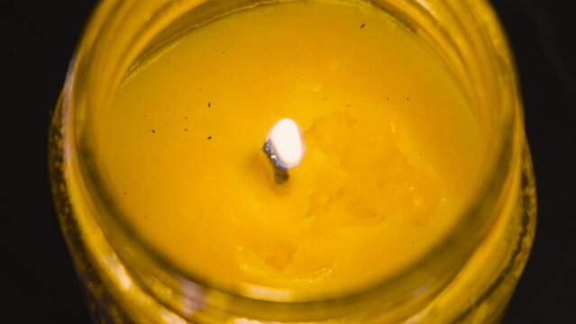 Close up slow motion look at a pop in the wick.