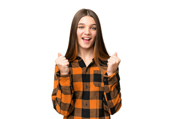 Teenager girl over isolated chroma key background celebrating a victory in winner position