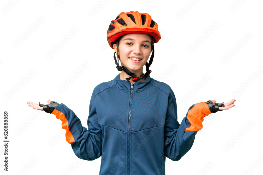 Wall mural Teenager cyclist girl over isolated chroma key background with shocked facial expression