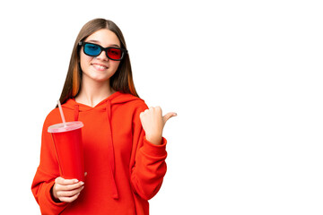 Teenager girl in a cinema over isolated chroma key background pointing to the side to present a product - obrazy, fototapety, plakaty
