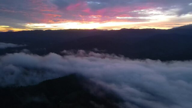 Mountain with foggy in morning moving on blue sky natural background. top view with frist light golden time.
