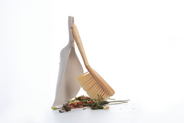 A dustpan with garbage on a white background. The concept of purity.Copy space. solated object.
