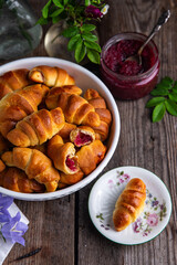 Homemade crescents with edible rose jam. Traditional Ukrainian baked goods.