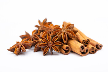 Star anise and cinnamon sticks on a white background isolated. Indian spices close up. Medicinal herbs and spices.