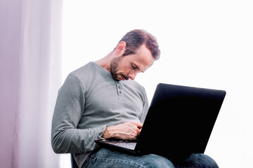 Man sleeping in front of his computer. Concept of overwork. Selective focus.