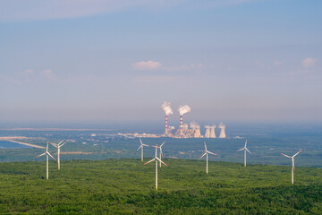 Wind power plant grid against traditional coal power station, aerial landscape