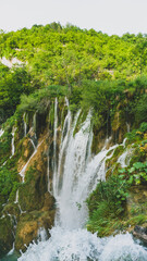 Fototapeta na wymiar Majestic waterfall with vivid colors in Plitvice Lakes, Croatia