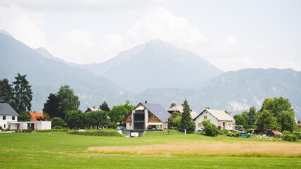 Fototapeta na wymiar Panorama of an alpine village with modern houses in Slovenia