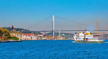 Sea voyage with old ferry (steamboat) on the Bosporus - Ortakoy mosque and Bosphorus bridge -...