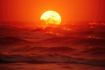 Deurstickers Donkerrood Red sun over the ocean in high waves. Sunset over the sea. Sunset on the beach. Ocean waves on red sun sunset. 