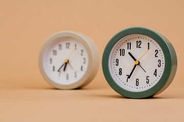 Alarm clock. Beautiful modern clock lies on paper background. time clock time standstill time off...