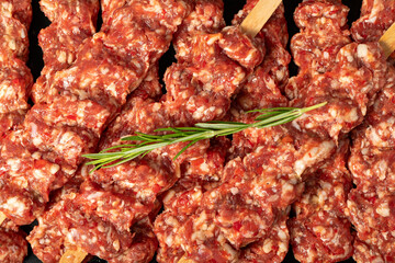 Adana kebab. Close-up Turkish raw adana kebab. Food background.Turkish cuisine delicacies