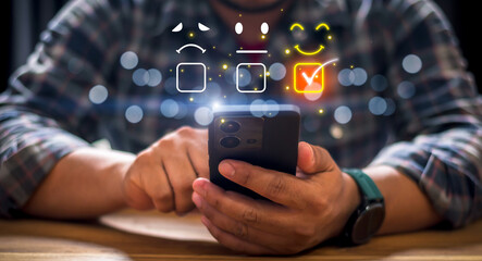 Customer review satisfaction feedback survey concept, Businessman using hand holding Smartphone and touching to tick sign on virtual smiley face for client evaluation product and service best quality.