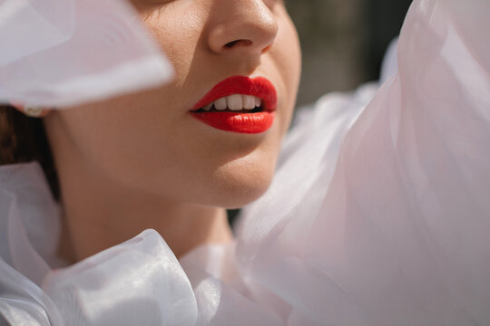 Portrait of a glamorous woman in a ruffled blouse