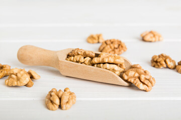Fresh healthy walnuts in bowl on colored table background. Top view Healthy eating bertholletia concept. Super foods