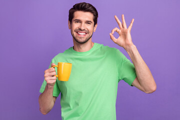 Photo of young promoter guy showing okey sign alright good quality cappuccino enjoy tasty arabica...
