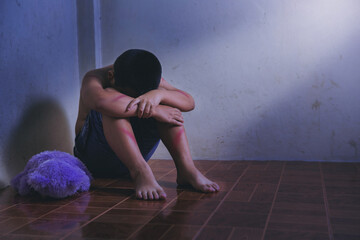 Abused children sitting, crying, stressed child, domestic violence and violence, aggression concept.