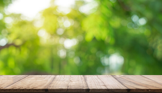 Empty wood plank table top with blur park green nature background bokeh light, Mock up for display or montage of product, Banner or header for advertising on social media, Spring and Summer concept