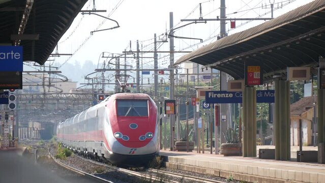 A Train at a Railway Station Passing by an Empty Platform Without Stopping