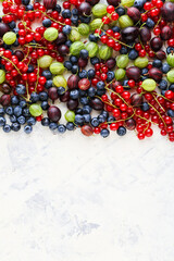 Berries background with free space light surface