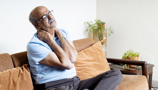 Asian senior man having neck pain, cervical spine sickness. old people with health problem - Powered by Adobe
