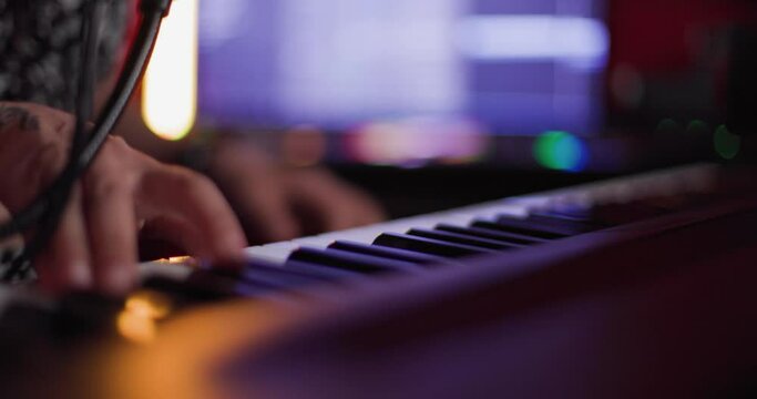 Abstract female hand playing keyboard instrument. Dj or music producer making audio tracks.