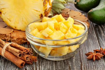 sliced pineapple on wood background
