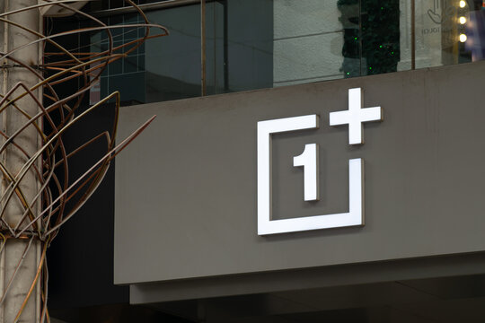 Picture of logo of famous mobile phone brand 'one plus'. Facade of OnePlus smartphone retail store. A Chinese consumer electronics company. Mobile, tablets, laptops.