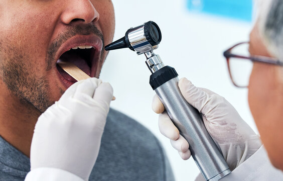 Medical, consulting and doctor with mouth of person and check for cancer, dentist or surgery. Medicine, healthcare and check up with closeup of woman and patient in clinic for wellness, virus or exam