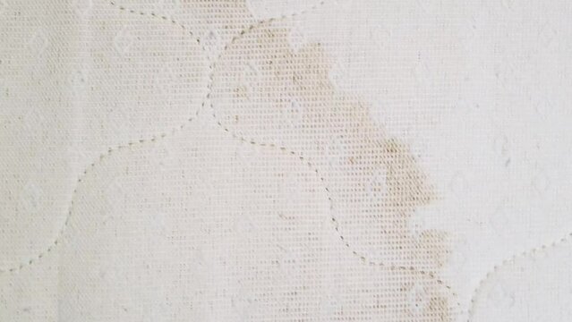 dirty mattress. Dirty yellow spots on the mattress of the bed, bed with fundus dirty