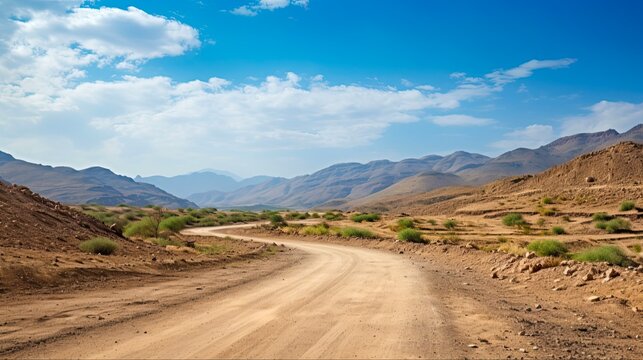 Arabian dirt road in Hajar mountains of Dubai. Scenic view of the beautiful and barren landscape with bright blue skies and white clouds. Generative AI