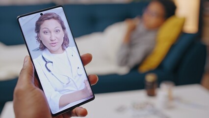 Worried parent talking with pediatrician online, caring for sick child, consultation