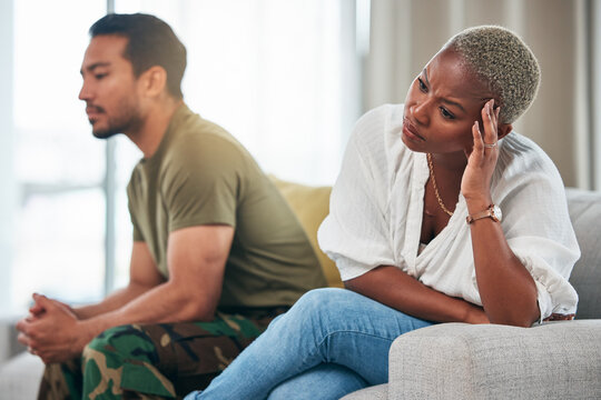Separation, conflict and couple on a couch, ignore and anger with depression, argument and divorce. Relationship, black woman or Asian man on a sofa, fighting and angry with a dispute, home and upset