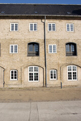 Facade of a historic terraced house with  a clear blue sky in Copenhagen in Denmark