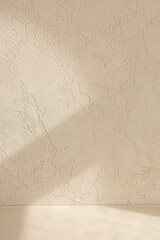 light beige painting background with light and shadow on wall.
