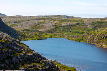 Northern mountains, the sea and mountain cold lakes on the Kola peninsula. Teriberka village