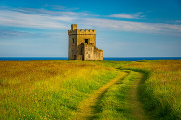 Historical turret building along the coastline © Alexander